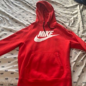 Medium Nike Hoodie lightly worn.Has subtle black paint splatter design over logo